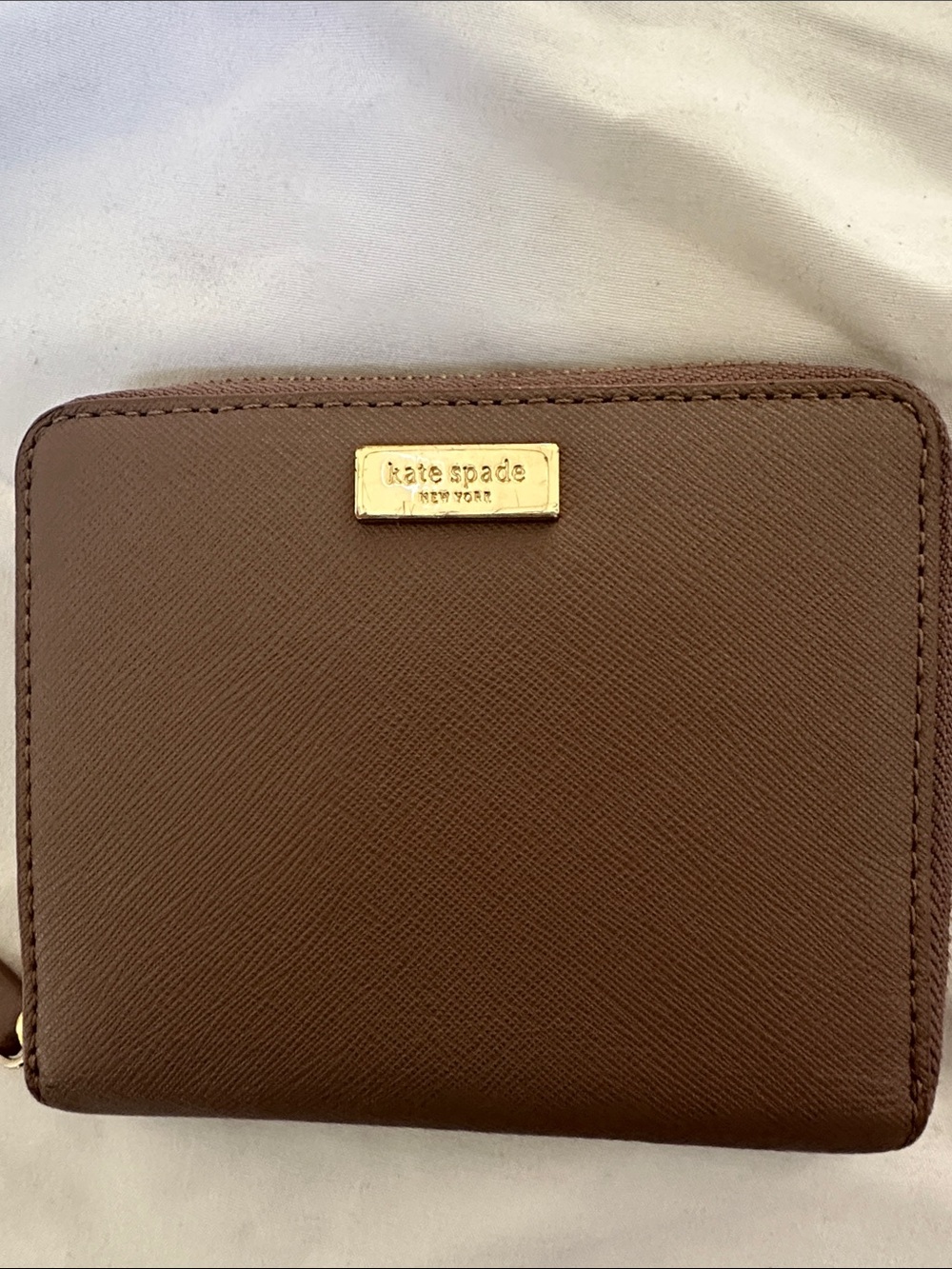 kate spade brown Saffiano zip-around wallet with gold plaque